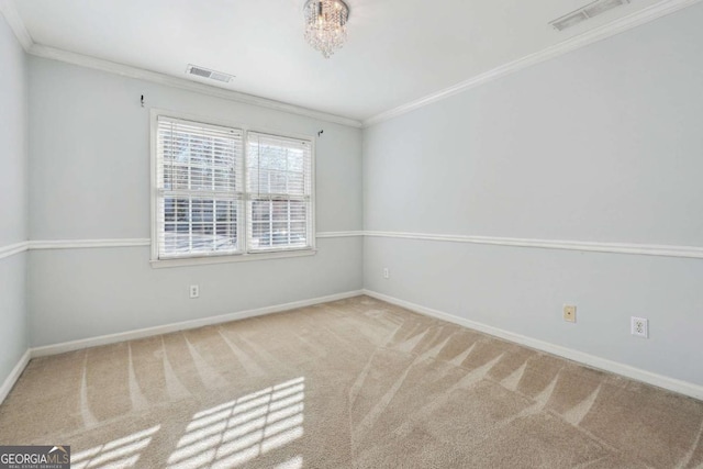 unfurnished room with carpet, a chandelier, and ornamental molding