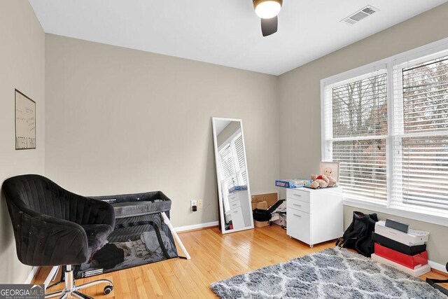 office featuring light wood-type flooring and ceiling fan