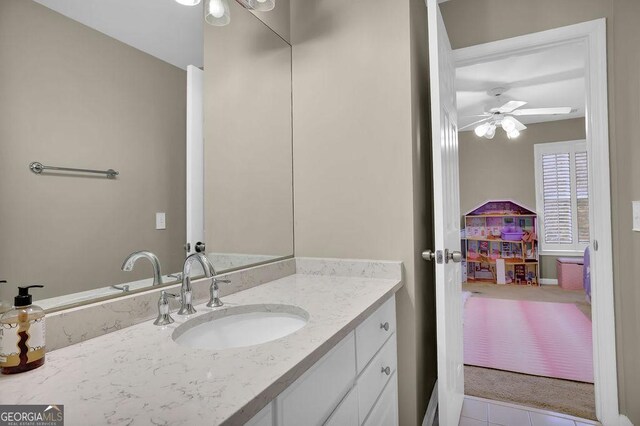 bathroom featuring vanity, tile patterned floors, and ceiling fan