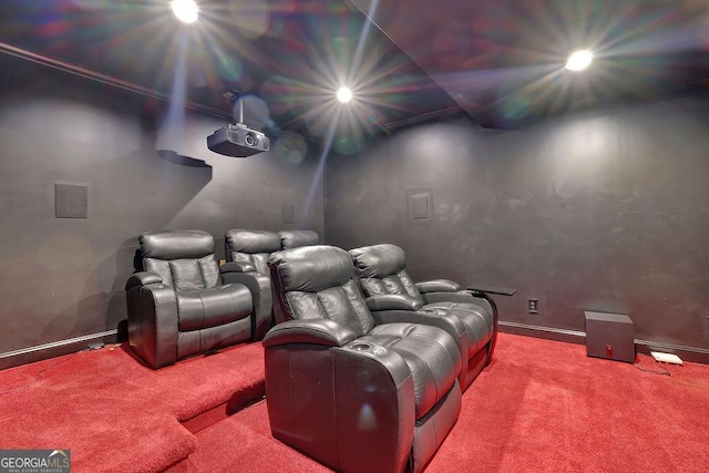 carpeted cinema featuring ornamental molding