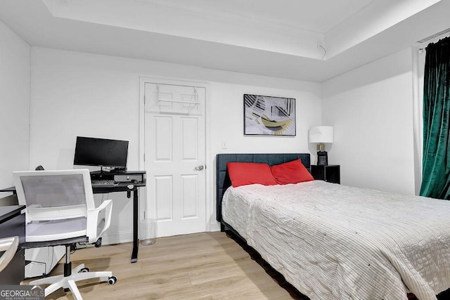 bedroom with hardwood / wood-style floors