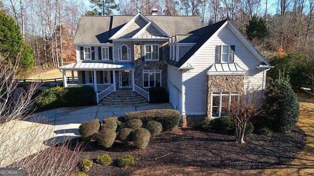 view of front of home featuring a porch and a garage