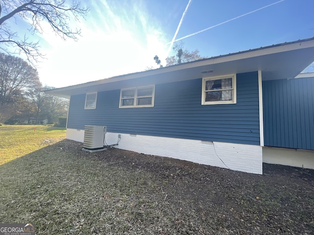 view of side of home with cooling unit