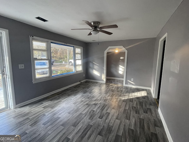 spare room with dark hardwood / wood-style floors and ceiling fan