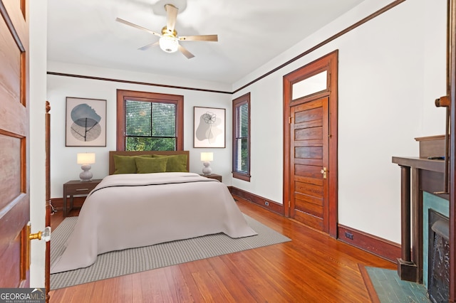 bedroom featuring ceiling fan and hardwood / wood-style flooring