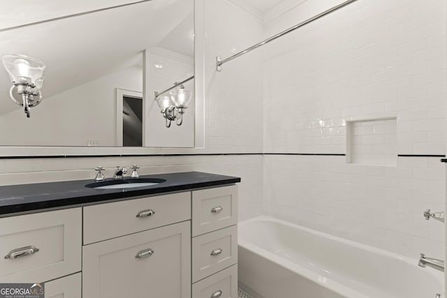 bathroom with vanity and bathtub / shower combination