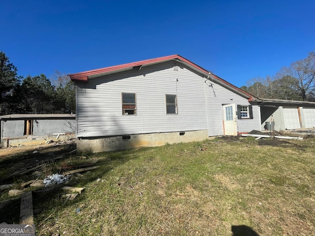 view of home's exterior with a yard