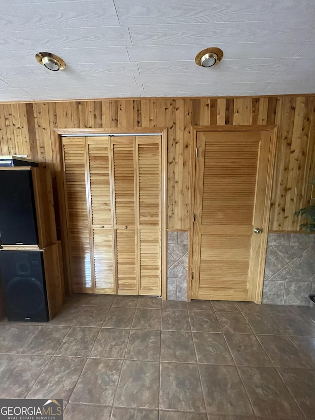 interior space featuring wood walls