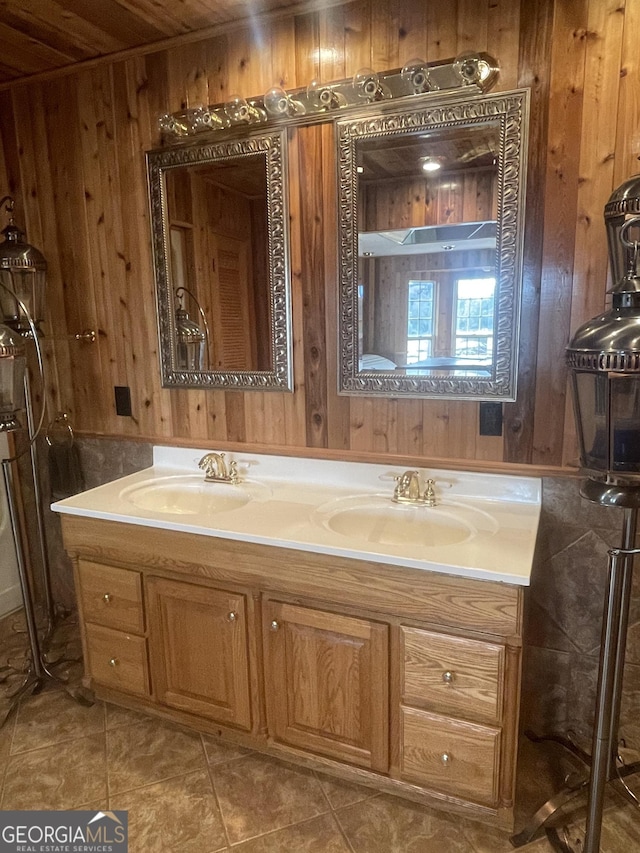 bathroom featuring tile patterned flooring, vanity, wooden walls, and wood ceiling