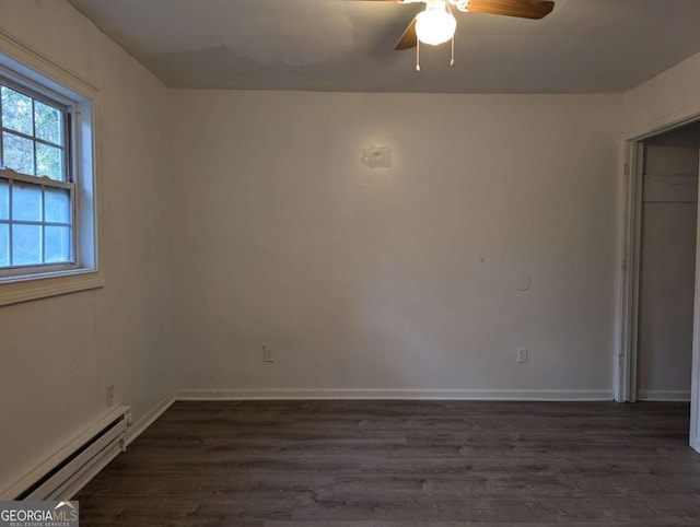 spare room with ceiling fan, dark hardwood / wood-style flooring, and a baseboard radiator