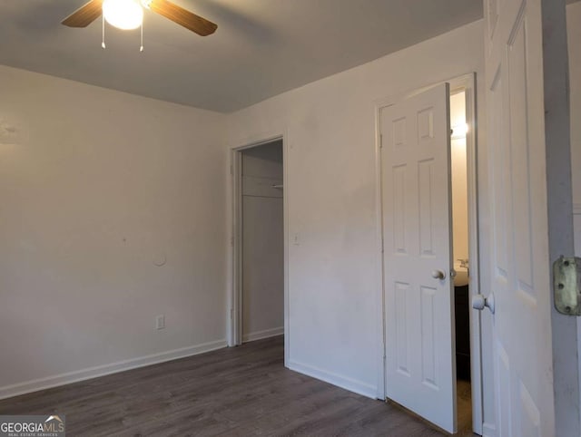 interior space with dark hardwood / wood-style flooring and ceiling fan