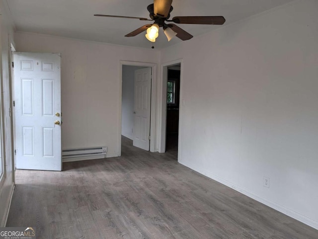 unfurnished room with wood-type flooring, ceiling fan, and a baseboard heating unit