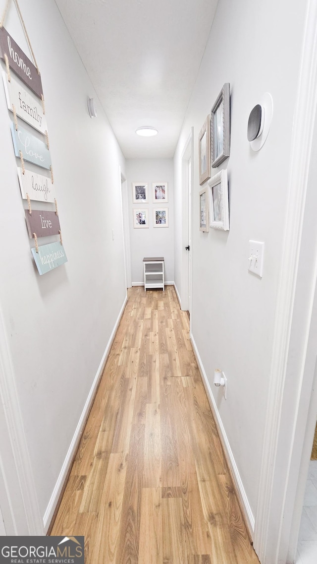 corridor featuring light hardwood / wood-style flooring