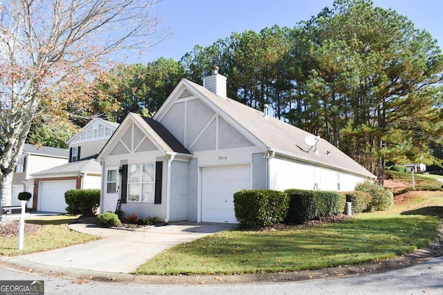 view of front of property featuring a garage and a front lawn