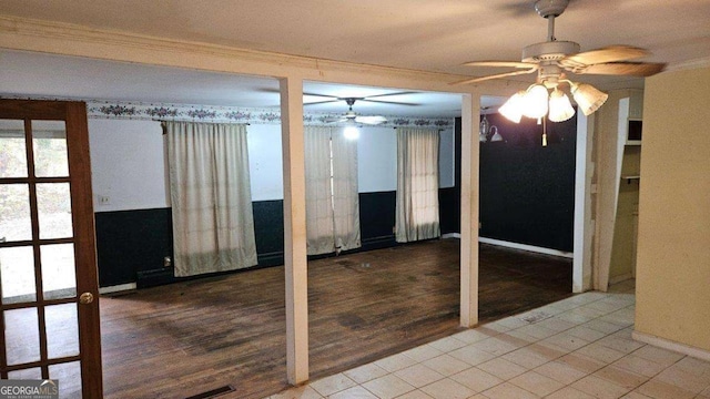 interior space featuring crown molding, ceiling fan, and wood-type flooring