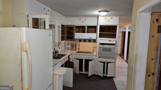 kitchen with white cabinets, white appliances, and sink