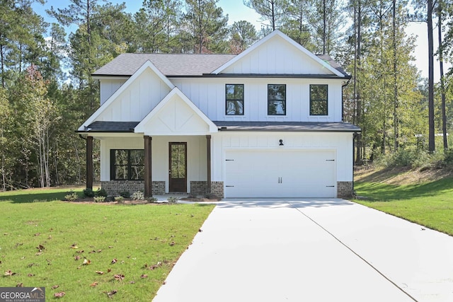 view of front of home featuring a garage and a front yard