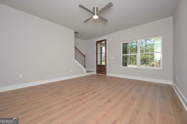 unfurnished living room with ceiling fan and light hardwood / wood-style flooring