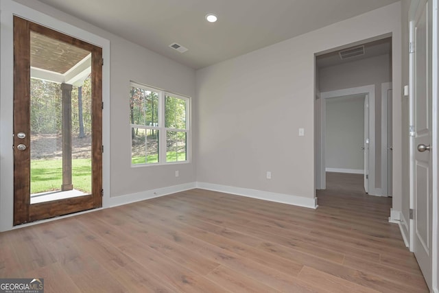 unfurnished room featuring light wood-type flooring