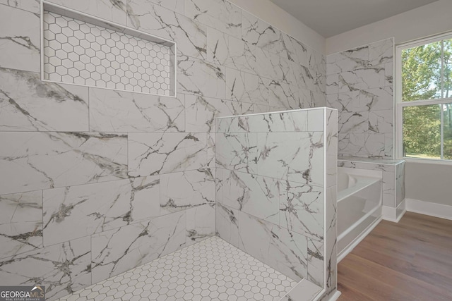 bathroom with wood-type flooring and plus walk in shower