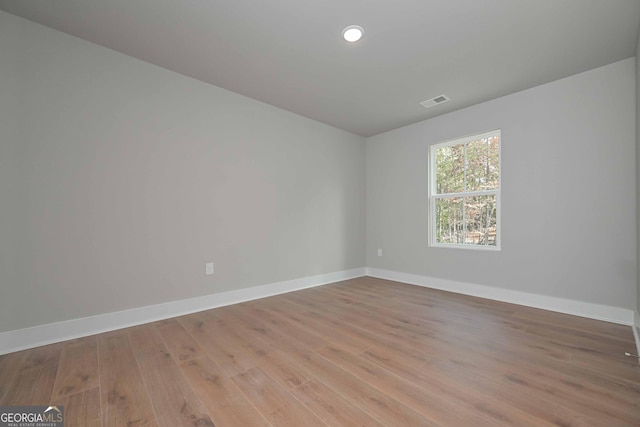 spare room with light hardwood / wood-style flooring