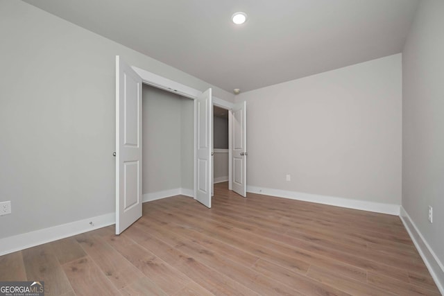 unfurnished bedroom featuring light hardwood / wood-style floors