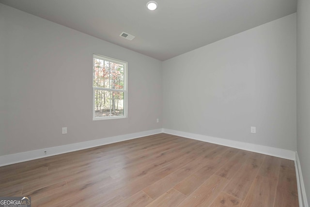 spare room featuring light wood-type flooring