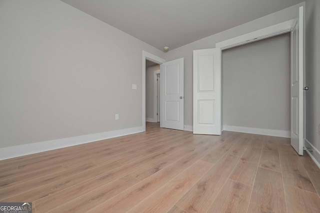 unfurnished bedroom with light hardwood / wood-style floors