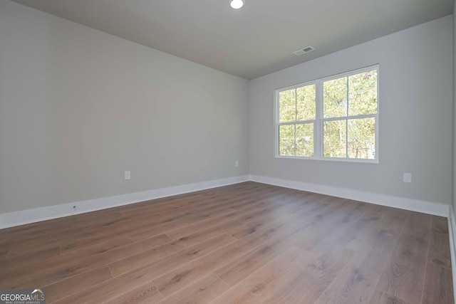 empty room with wood-type flooring