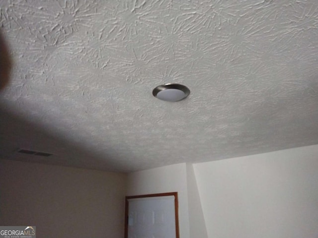 room details with a textured ceiling