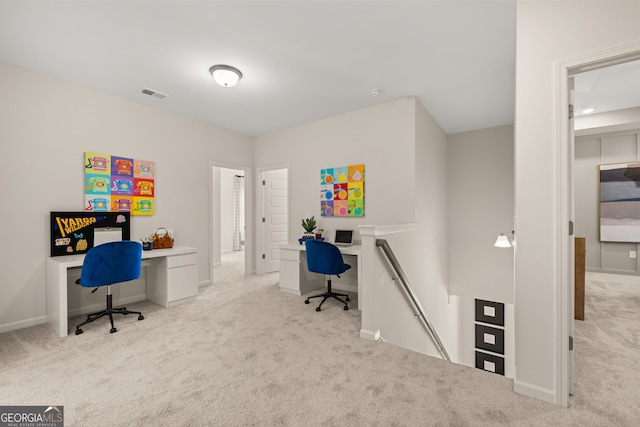 office space with light colored carpet