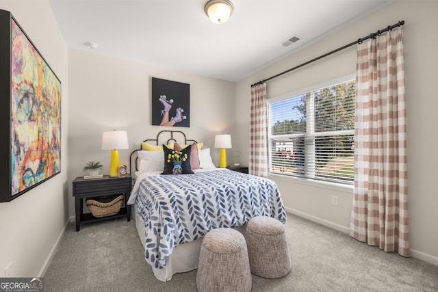 bedroom featuring light colored carpet