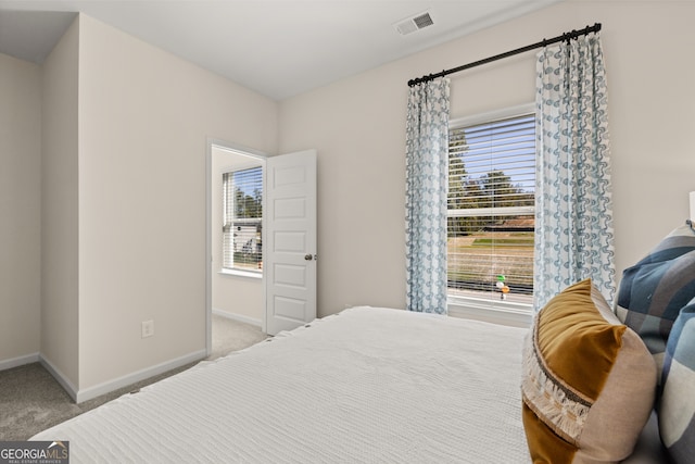 bedroom with light colored carpet