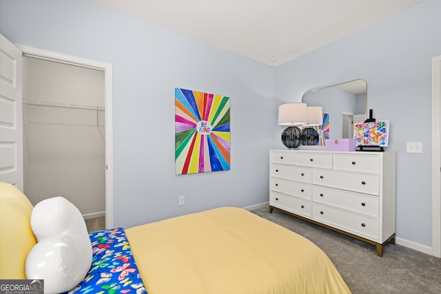 bedroom featuring dark carpet and a closet