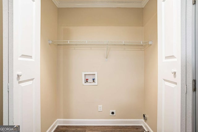 washroom featuring washer hookup, dark hardwood / wood-style floors, hookup for an electric dryer, and ornamental molding