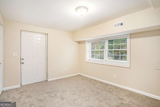 unfurnished room featuring carpet flooring