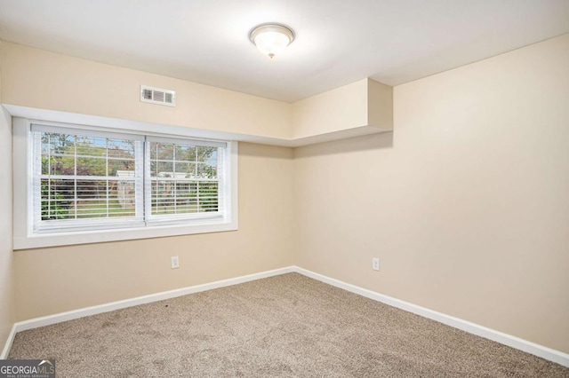 empty room with carpet flooring