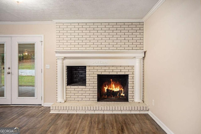 interior details featuring french doors, hardwood / wood-style floors, a textured ceiling, and ornamental molding