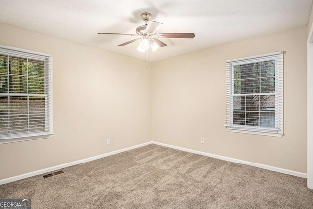 carpeted empty room with ceiling fan