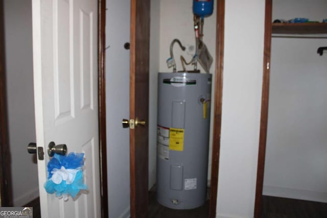 utility room featuring electric water heater