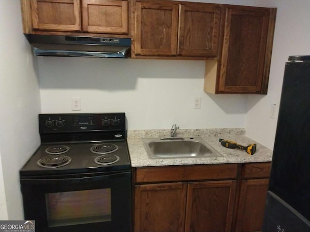 kitchen with black appliances and sink