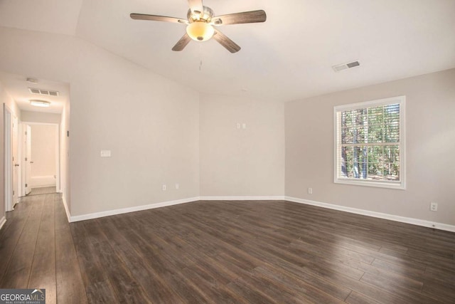 unfurnished room featuring lofted ceiling, ceiling fan, and dark hardwood / wood-style floors