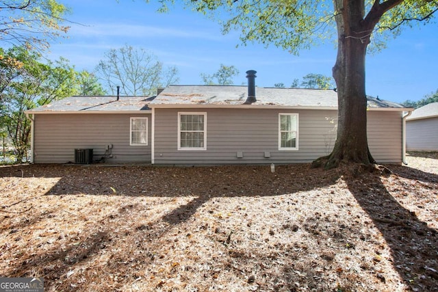 back of house featuring cooling unit