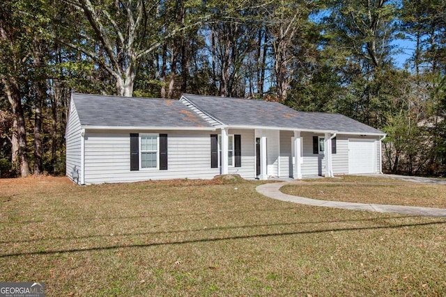 ranch-style house with a porch, a garage, and a front yard