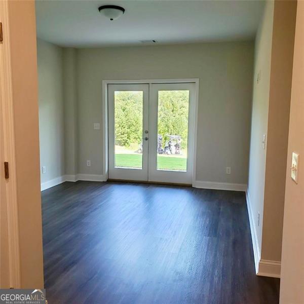 doorway to outside featuring french doors and dark hardwood / wood-style floors