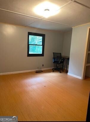 empty room with hardwood / wood-style flooring