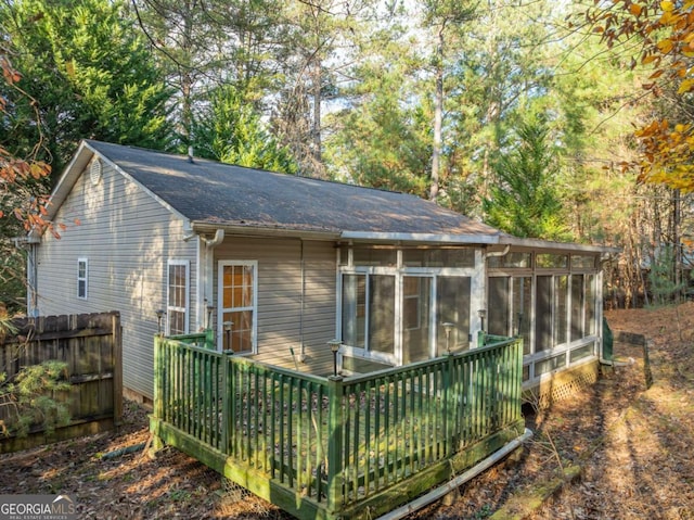 back of house featuring a sunroom