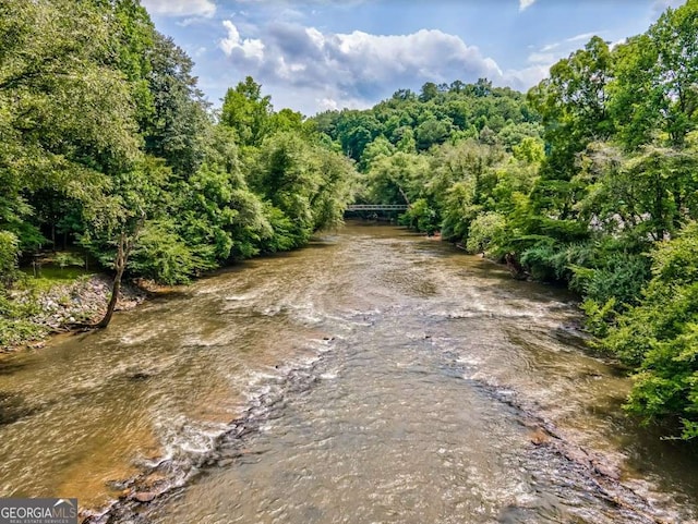 view of landscape with a water view