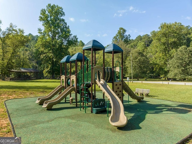 view of jungle gym with a lawn