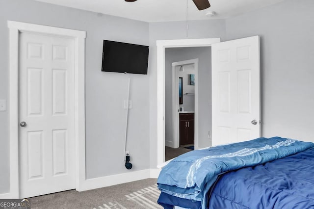 bedroom featuring carpet floors, ensuite bath, and ceiling fan